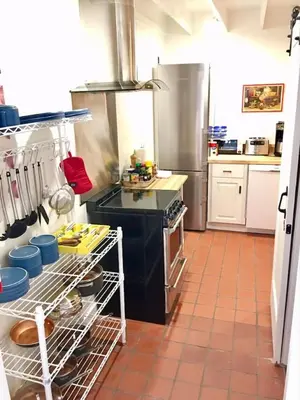 a kitchen with a stove and a dishwasher at Catskill Cabin Duplex Apartment in Shandaken