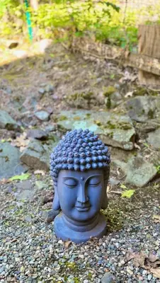 a statue of a head on the ground at Catskill Cabin Little Owl Apt 1 in Shandaken