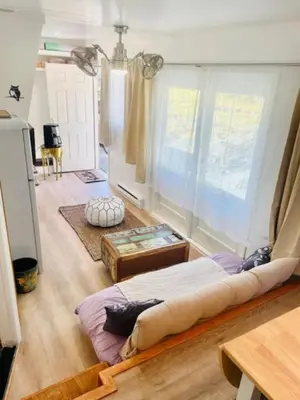 a bedroom with a large bed in a room at Catskill Cabin Little Owl Apt 1 in Shandaken