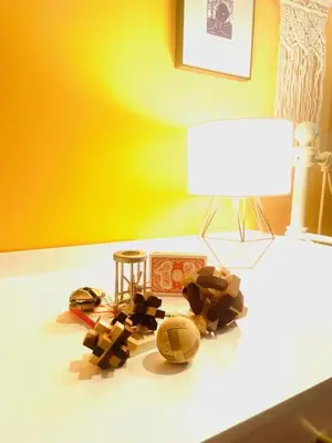 a table with a lamp and some toys on it at Catskill Cabin Apres Ski in Shandaken