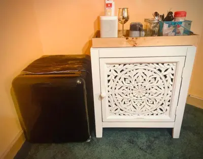 a refrigerator next to a white cabinet with a white door at Catskill Cabin Apres Ski in Shandaken