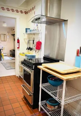 a kitchen with a stove and a counter top at Alpine Four Season Lodge Shandaken NY sleeps 18 in Shandaken