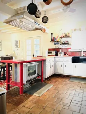 a kitchen with a red island in a kitchen at Alpine Four Season Lodge Shandaken NY sleeps 18 in Shandaken