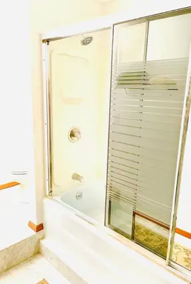 a shower with a glass door in a bathroom at Alpine Four Season Lodge, Belleayre NY, Sleeps 22, in Shandaken