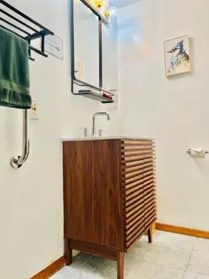 a bathroom with a sink and a mirror at Alpine Four Season Lodge, Belleayre NY, Sleeps 22, in Shandaken