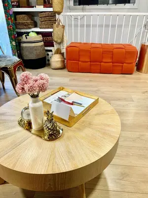 a wooden coffee table with a vase of flowers on it at Paloma, Large Attic Apartment in Shandaken