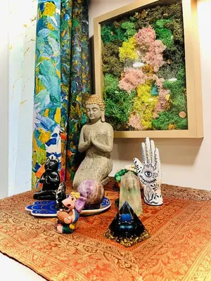 a group of figurines sitting on a table with a painting at Paloma, Large Attic Apartment in Shandaken