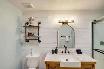 a bathroom with a sink and a mirror at Elegant Hudson Valley Retreat with Hot Tub and Pond in Austerlitz