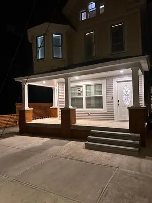 a house with a front porch with a white door at 4 bed Luxury house in Schenectady