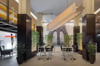 a lobby with tables and chairs and a building at 73-1504 Newly Reno Studio UWS Doorman Gym Laundry in New York