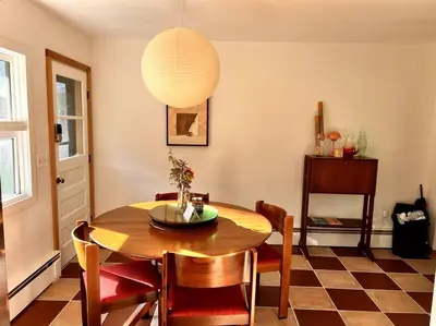 a dining room with a table and chairs at The Mod Cabin in Bearsville