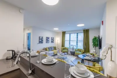 a kitchen and living room with a living room at Opulence in Olive with Free Parking plus EV Plug, 2 BR 2 baths Suite, 5 beds and Sleeps 8 in Orange