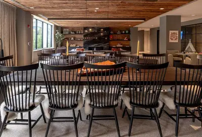 a dining room with a table and chairs at New Luxury Apt Downtown with Pool in Stamford