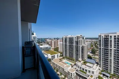 a view of a city from the balcony of a building at Trendy Apt On Harbor with Gym in Stamford