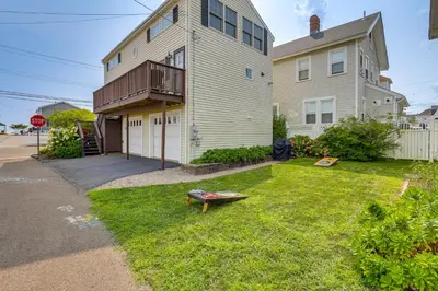 a house with a yard with a boat in the grass at Walk to Beaches Sunny East Haven Home with Grill in West Haven