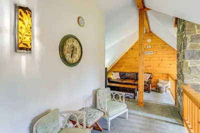 a living room with chairs and a couch at Spacious Wilmington Cabin Walk to Lake in Wilmington