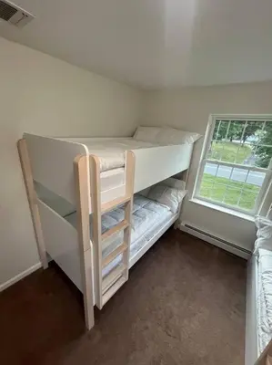 a white bunk bed with a window in a room at Cozy Beautiful Pondside Luxurious Retreat in Monroe