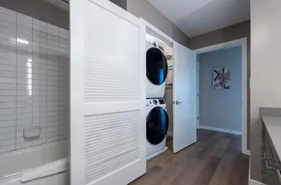 a laundry room with a washer and dryer at Luxury Apt On Harbor in Stamford