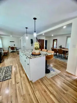 an empty room with a kitchen and a living room at Spacious 4BR home w 2BA, a workspace & king bed! in Fort Plain