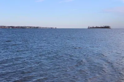 an island in the middle of a large body of water at Pet Friendly Milford Beachfront Home in Stratford