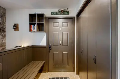 a locker room with a bench next to a door at The Seasons G27 in Dover