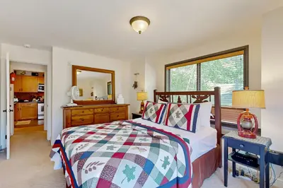 a bedroom with a bed and a large window at The Seasons G27 in Dover