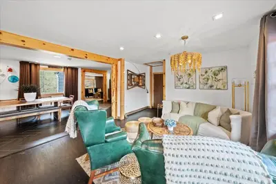 a living room with a couch and chairs and a table at Green Acres Retreat in Hancock