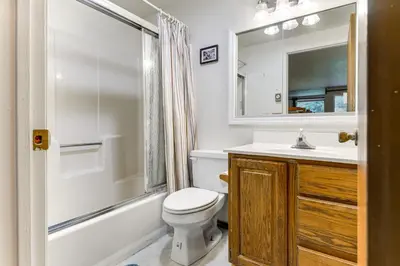 a bathroom with a toilet and a sink and a shower at West Dover Townhome Hot Tub, 2 Mi to Mount Snow! in West Dover