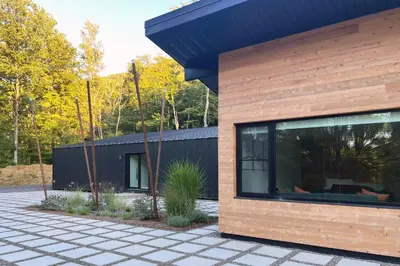 a modern house with a black roof at Coldbrook Bed and Breakfast in Bearsville