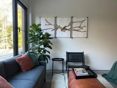 a living room with a couch and a table at Coldbrook Bed and Breakfast in Bearsville