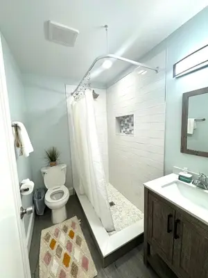 a bathroom with a shower and a toilet and a sink at Solano Inn in Portland