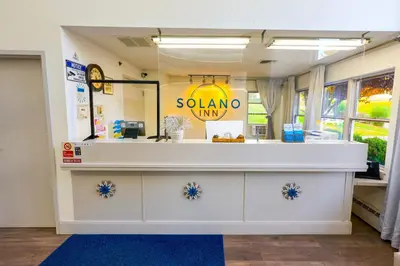 a store with a white counter in a room at Solano Inn in Portland