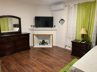 a living room with a television and a fireplace at 2265 Bruckner Blvd Apartments in Bronx