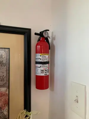 a fire hydrant hanging on a wall next to a mirror at 2265 Bruckner Blvd Apartments in Bronx