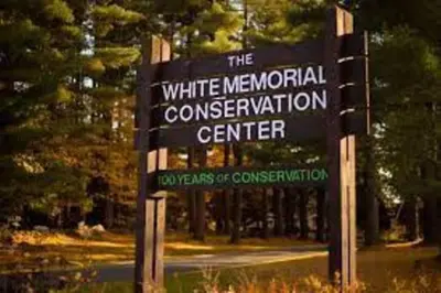 a sign for the white memorial convention center at Historic Colonial Pool Walk to Town in Litchfield