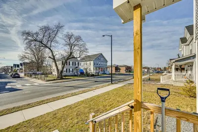 a view from a porch of a street with houses at 1 Mi to MGM Springfield Cozy Winter Duplex! in Springfield