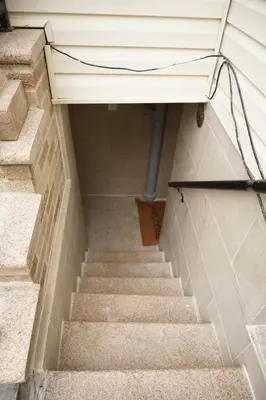a set of stairs leading up to a building at Cozy 2 Bedroom In A Lovely Forest Hills Neighborhood in Parkside