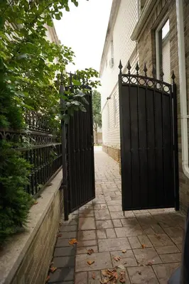 an entrance to a house with a black iron gate at Cozy 2 Bedroom In A Lovely Forest Hills Neighborhood in Parkside