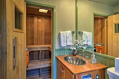 a bathroom with a wooden sink and a mirror at Catskill Ski Mountain Retreat with Private Pool in Big Indian