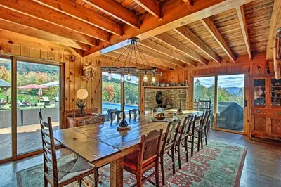a dining room with a large wooden table and chairs at Catskill Ski Mountain Retreat with Private Pool in Big Indian