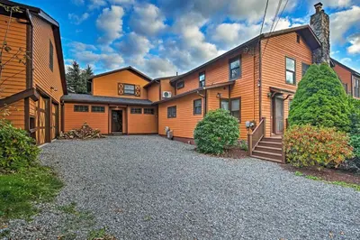 a large house with a driveway in front of it at Catskill Ski Mountain Retreat with Private Pool in Big Indian