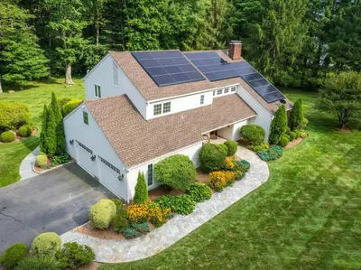 an aerial view of a house with solar panels on it at Green Utopia in New Canaan