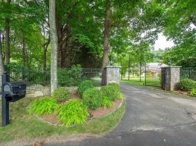 a park with a fence and a parking meter at Green Utopia in Wilton