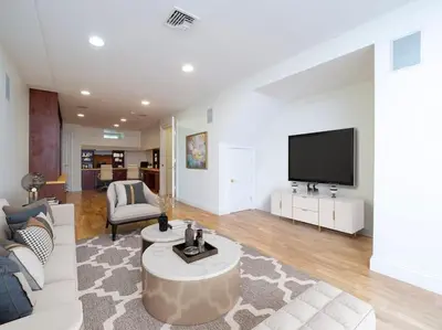 a living room with a couch and a tv at Green Utopia in Wilton