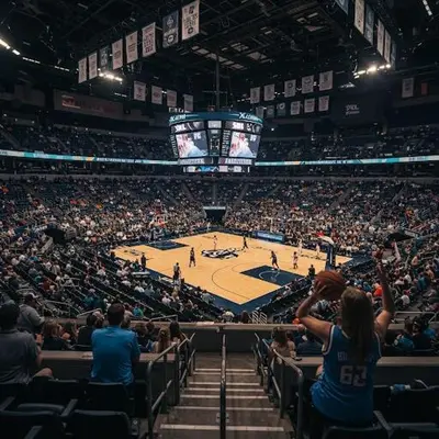 a crowd of people watching a basketball game in an arena at Convention Center 1BR Condo Downtown Hartford and GYM in Hartford