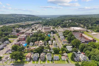 an aerial view of a town with trees and houses at Freshly Redone & Newly Furnished! A MUST SEE! in New Britain