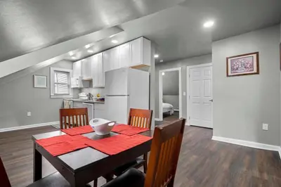 a kitchen and dining room with a table and chairs at Freshly Redone & Newly Furnished! A MUST SEE! in New Britain