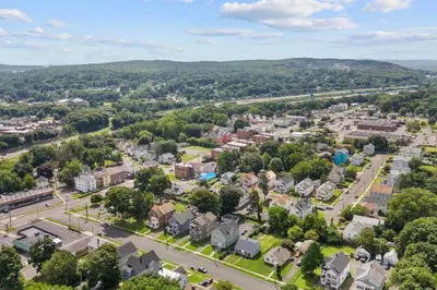 an aerial view of a town with trees and houses at Freshly Redone & Newly Furnished! A MUST SEE! in New Britain