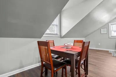 a dining room with a table and four chairs at Freshly Redone & Newly Furnished! A MUST SEE! in New Britain
