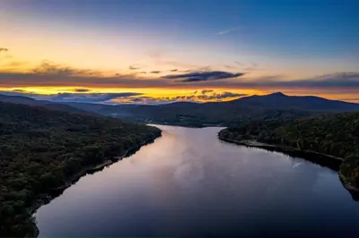 an aerial view of a river at sunset at Vermont Lake Whitingham Mount Snow Area Apartment in Jacksonville